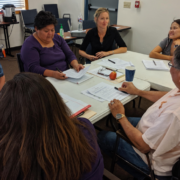 Educators sitting at table at Teaching Native Waters workshop